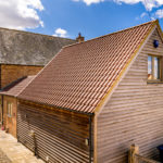 Barn Style Dwelling on farm - using slate, clay pantiles, timber cladding and brickwork in Flemish Bond.