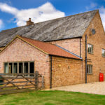  Barn Style Dwelling on farm - using slate, clay pantiles, timber cladding and brickwork in Flemish Bond.