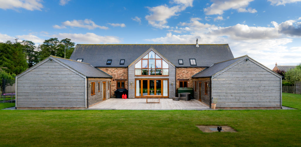 Barn Style Dwelling – adjacent to conservation area, using slate, brick and timber cladding.